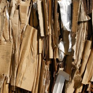 ESSEX, UK, 24/03/2024. Stacked flattened cardboard sheets in recycling storage area