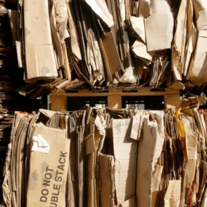 ESSEX, UK, 24/03/2024. Stacked flattened cardboard sheets in recycling storage area