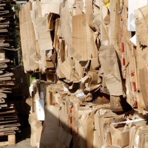 ESSEX, UK, 24/03/2024. Stacked flattened cardboard sheets in recycling storage area