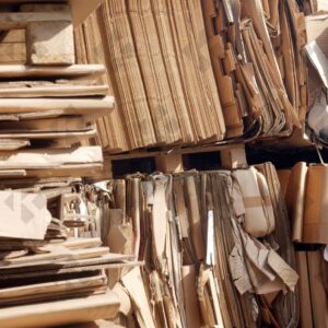 ESSEX, UK, 24/03/2024. Stacked flattened cardboard sheets in recycling storage area