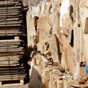 ESSEX, UK, 24/03/2024. Stacked flattened cardboard sheets in recycling storage area