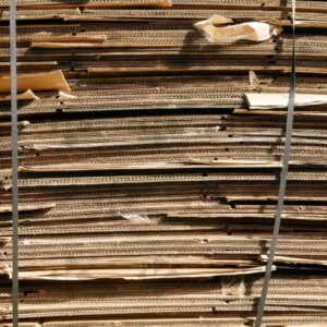 ESSEX, UK, 24/03/2024. Stacked flattened cardboard sheets in recycling storage area