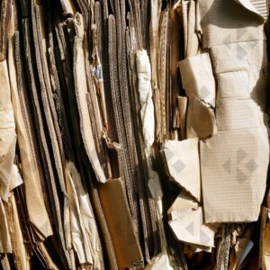 ESSEX, UK, 24/03/2024. Stacked flattened cardboard sheets in recycling storage area