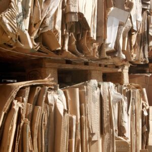 ESSEX, UK, 24/03/2024. Stacked flattened cardboard sheets in recycling storage area